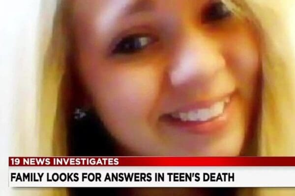 Screenshot of closeup of blond teen from tv news report on investigation into teen's death.